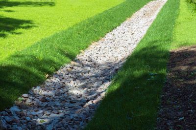 Get a Ditch Lined with Grass, Stones, or Other Porous Materials to Create a Drainage Swale!